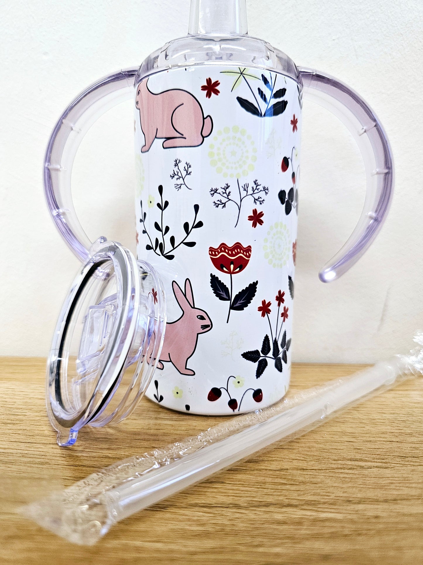 Sippy cup tumbler 12oz with double handle and straw lid rabbit and floral design.